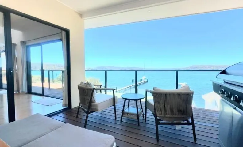 Peaceful Waterfront Retreat with Private Jetty Near Train