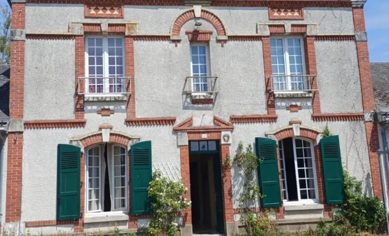 Maison aux volets verts