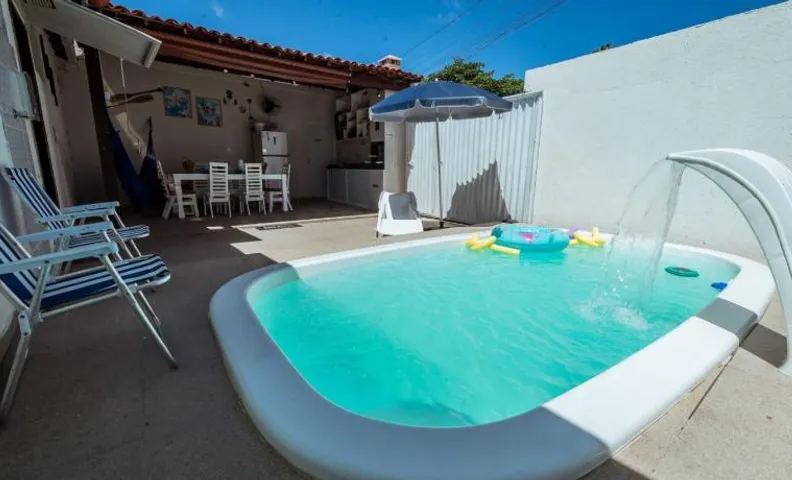 Casa em Praia Formosa com 4 Suítes, Piscina, Churrasqueira e Garagem